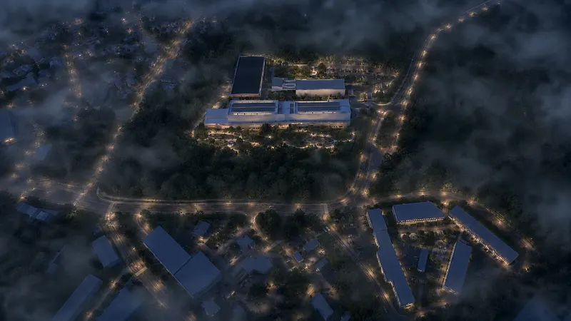 Noční 3D vizualizace výrobního areálu s nasvícenými fasádami hal a komunikacemi