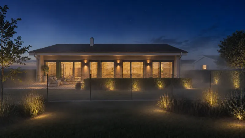 Noční 3D vizualizace moderního bungalovu s teplým osvětlením terasy a nasvícenou zahradou