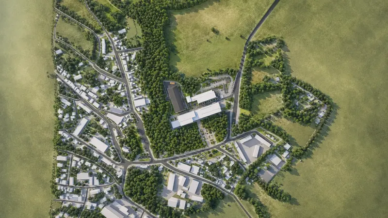 Letecká 3D vizualizace průmyslové haly a výrobního areálu zasazeného do zeleně obce